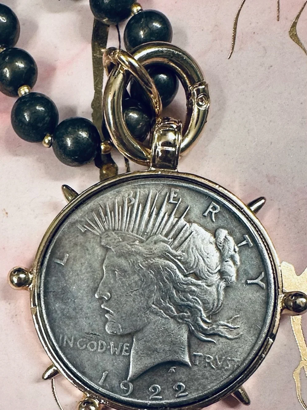 Large silver tone coin in gold tone setting on pyrite necklace with earrings